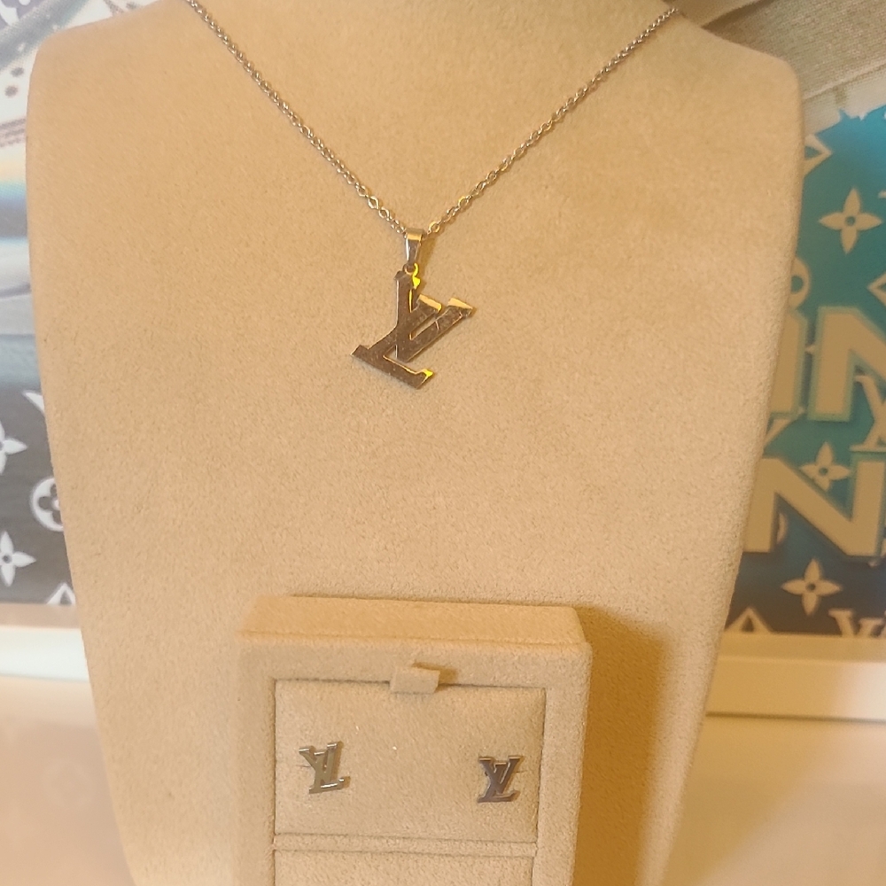 Stainless Steel Pendant Necklace And Matching Stud Earrings